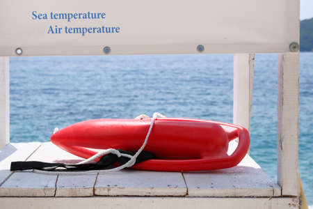 Outfit of lifeguard on sea in summer. Rescue on water in summer concept.の写真素材