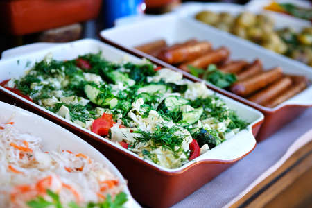 Salad in container in eat market in street. Street food and outdoor cooking concept.