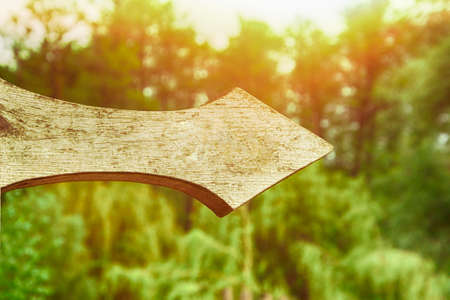 Wooden vintage pointer. Vertical view of rustic handmade wooden sign. Direction to right. Mockup.の写真素材