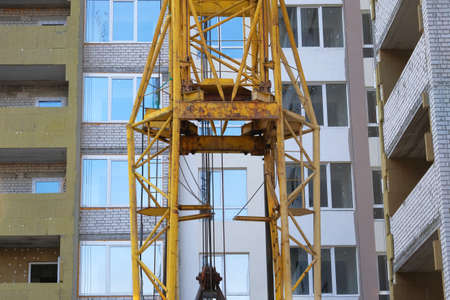 Construction site. Building site of new home. Mineral wool or fiber glass for house heat insulation,...
