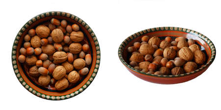Nuts in a plate isolated on white background. Healthy vegan vegetarian snack or ingredient for...
