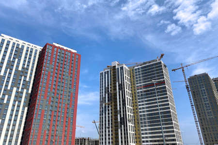 Building and Construction site of new homes. Mineral wool for insulated house. Facade of many story...