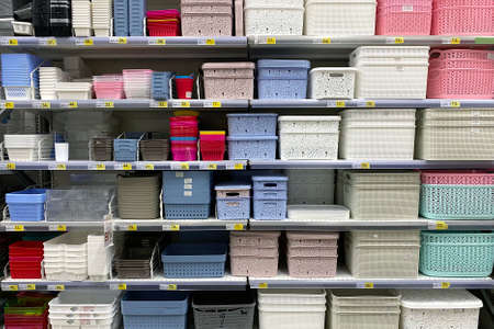 Shelves in the store with plastic storage boxes. Inexpensive alternative to subjects made from...