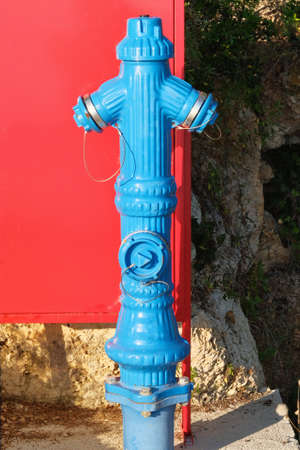 Typical red fire hydrant. Fire hidrant for emergency fire access.の写真素材