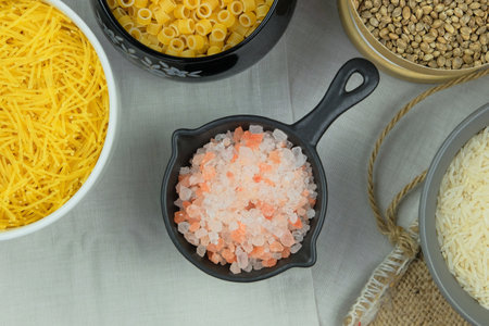 Pink Himalayan salt in bowl. Ingredient in cooking. Top view.の写真素材