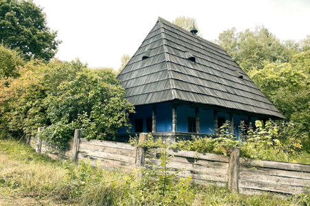 Wooden old house and fence. Countryside. Historic europen culture in travel.の写真素材
