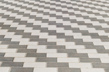 Grey Paving Slab, background. Pedestrian zone in city in daylight.