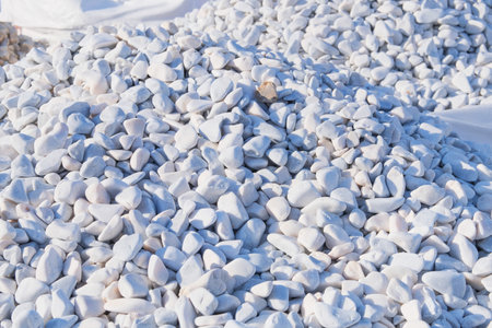 Decorative stones are sold in construction market. Light pebbles. Natural stone material for...