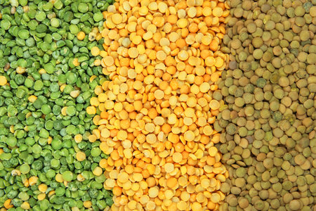Top view. Variety of protein products for vegetarians. Yellow and green peas and lentils. Grocery...