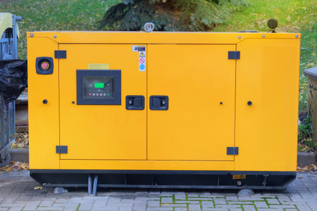 Emergency use of electricity outdoors. Standby industrial diesel generator for emergency power supply. Generator with internal combustion engine.の写真素材