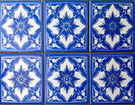 Texture of ceramic tile in oriental style in blue tones. Design mockup for bathroom interior. Decoration background. Geometric pattern. Close-up texture.の素材