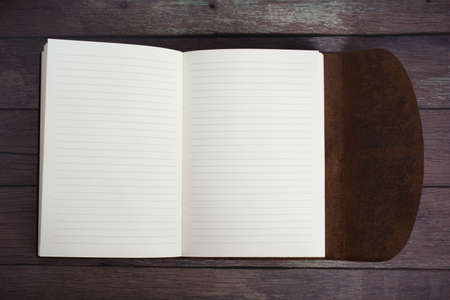 Classic Leather Bound Journal Book Fully Open on a Old Barn Board Floor