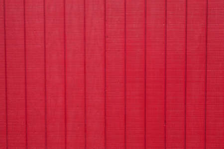 Worn rustic red barn board paneling textureの写真素材