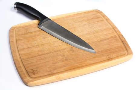 Wooden Cutting Board with Large Knife Laying Isolated on White
