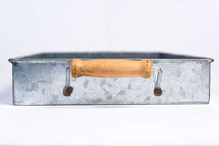 Galvanized Tin Box with Wooden Handles Isolated on White Side Viewの写真素材
