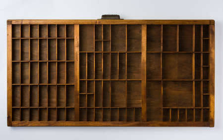 Antique Typesetter Drawer with Dividers on White Background Top View