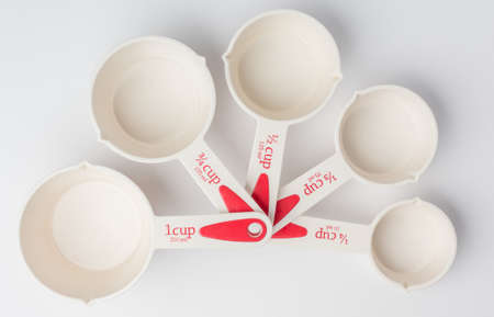 Set of Fanned Measuring Cups on White Background Top Viewの写真素材