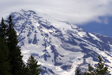 Eagles flying up near summit of Mount Rainierの写真素材