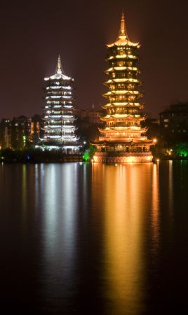 Sun, gold, and Moon, silver, Pagodas, Guilin, Guangxi, China at Night with Reflectionの写真素材