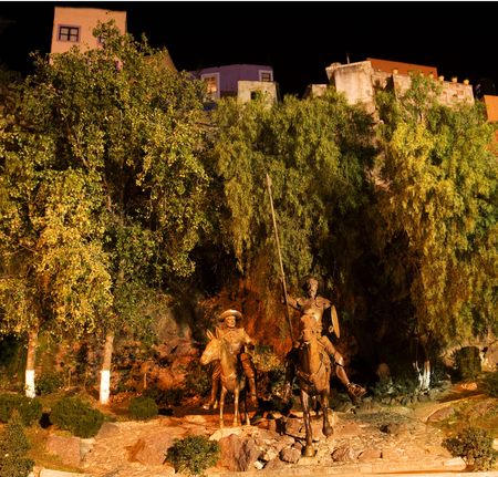 Famous Statue of Don Quixote and Sancho Panza at night, Guanajuato, Mexico.  Guanajuato is in love with Cervantes, the author, and has a Cervantes Museum.  This is one of the most popular public parks in Guanajuato.の写真素材