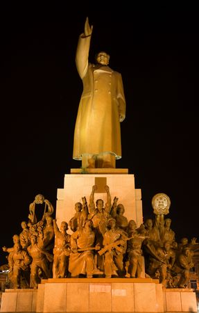 Mao Statue Heroes, Zhongshan Square, Shenyang, Liaoning Province, China at Night Lights Famous Statue built in 1969 in middle of Cultural Revolution.  Hero holding up a book of Mao Zedong thought.の写真素材
