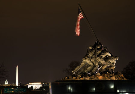 The Marine Corps War Memorial Shows the Raising of the Flag at Iwo Jima in World War II  Washington DC  Statue finished in 1954.  Lincoln Memorial, Washington Monument and Capital in the background.のeditorial素材