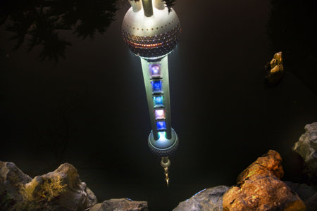 Reflection of Shanghai TV Tower at Night in Pond Pudong China 

のeditorial素材