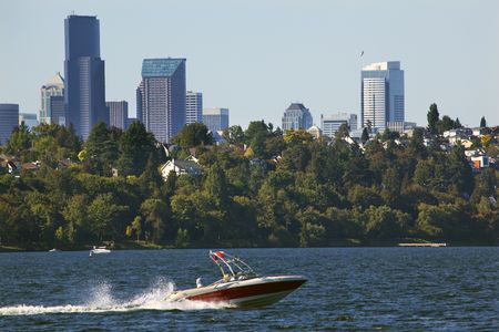 Seattle Skyline from Seward Park Red Speedboat on Lake Washington Homesの写真素材
