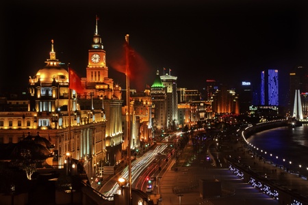 Shanghai China Bund at Night Cars, Flags Trademarks Obscuredの写真素材