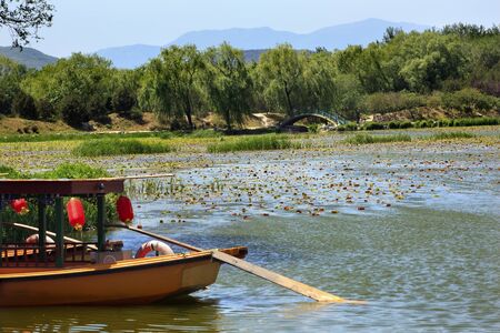 Yellow Boat Red Lantrns Yuanming Yuan Garden Lake Lily Pads Old Summer Palace Willows Beijing Chinaの写真素材