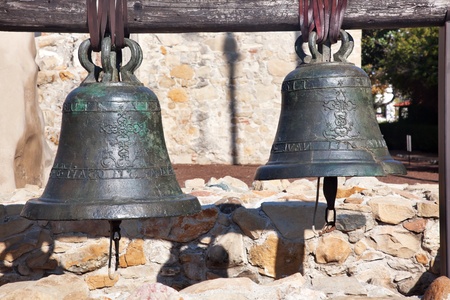 Old Brass Bells Mission San Juan Capistrano Churchand Ruins in California.  The church was destroyed in 1812 by earthquake and these are the old bells recovered from the ruins.の写真素材