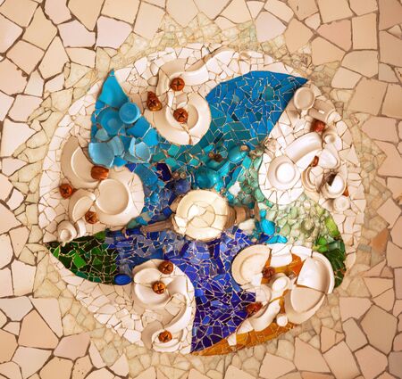 Antoni Gaudi ceramic mosaic design in Guell Park, Barcelona, Catalonia, Spain   Guell Park is a residential complex designed by Antnoi Gaudi between 1900-1914, which is now a public park  の写真素材
