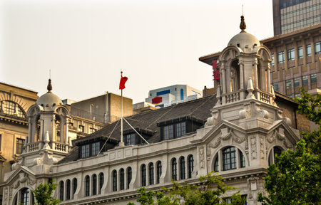 Three On the Bund Old Buildings and Modern Buildings on The Bund in the Old Part of Shanghai China   This is one of the most famous buildings on the Bund and the location of many of the best restaurants in Shanghai   Trademarks obscured のeditorial素材
