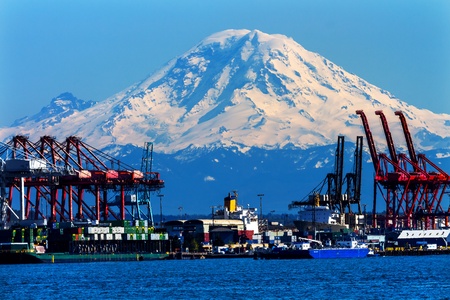 Seattle Port with Red Cranes and Ships Barges Pier and Dock Mt Rainier in the Background の写真素材