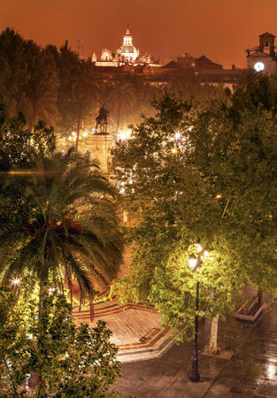 Plaza Nueva Ferdinand Statue Rainy Night Church El Salvador Seville Andalusia Spain の写真素材
