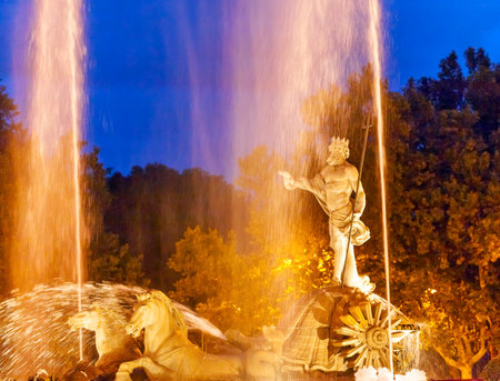 Neptune with Trident Snake in Chariot, Roman God, Statue Fountain Fuento de Neptuno Night Plaza Canovas del Castillo Madrid Spain   Neptune Statue designed in 1780 by Ventura Rodriguez as part of Carolos IIIのeditorial素材