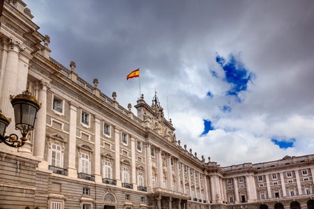 Royal Palace Palacio Real Clouds Sky Cityscape Spanish Flag Madrid Spain   Phillip 5 rreconstructed palace in the 1700s のeditorial素材