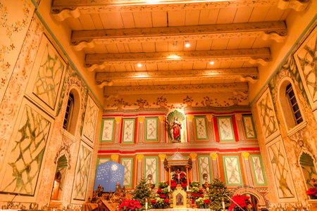 Old Mission Santa Ines Basilica Altar Cross Agnes Statue Solvang California at Christmas.  Founded in 1804, 19 of 21 Missions in California.  Named for Saint Agnes, young Roman girl martyr, symbol of purity and chastity.のeditorial素材