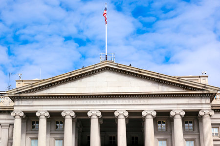 US Treasury Department Front Columns and Flag Pennsylvania Ave Washington DC. The Treasury is located next to the White House because President Andrew Jackson told his advisors that he wanted the National Bank to be right there where he could see it. US Treasury Department Front Columns and Flag Pennsylvania Ave Washington DC. The Treasury is located next to the White House because President Andrew Jackson told his advisors that he wanted the National Bank to be right there where he could see it.
