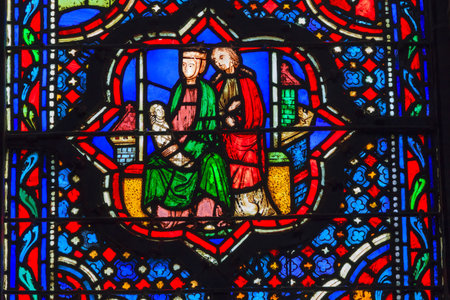 Jesus Mary Joseph Stained Glass Saint Chapelle Paris France.  Saint King Louis 9th created Sainte Chappel in 1248 to house Christian relics including Christ's Crown of Thorns.  Stained Glass created in the 13th Century and shows various biblical stories aのeditorial素材