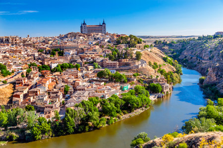 is Alcazar Fortress Medieval City Tagus River Toledo Spain.  Toledo Alcazar built in the 1500s, Destroyed in Spanish Civil War and then rebuilt after war. Unesco historical site; Tagus is longest river in Spain.のeditorial素材
