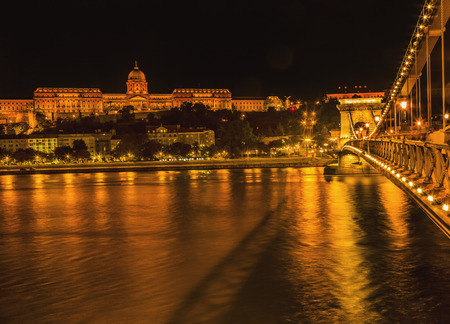 Buda Castle Chain Bridge Danube River Reflection Budapest Hungary.  Buda Castle was first built in 1242 and enlarged by Empress Maria Theresa in the 1700s.の写真素材