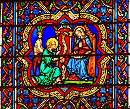 Annunciation Angel Gabriel Telling Virgin Mary About Jesus Stained Glass Notre Dame Cathedral Paris France.  Notre Dame was built between 1163 and 1250 AD.のeditorial素材