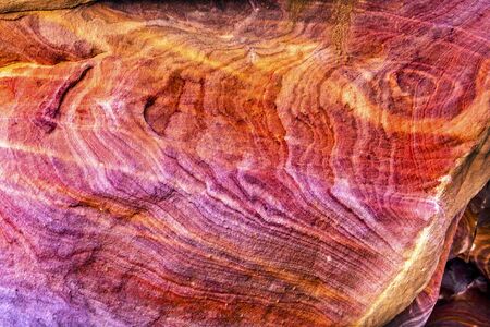 Red Rock Abstract Petra Jordan  Built by the Nabataens in 200 BC to 400 AD.  Rose Red canyon walls create many abstracts close up.  Inside the Tombs, the rose red can become blood red.  Reds are created by magnesium in sandstone.の写真素材