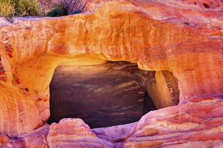 Rose Red Rock Tomb Street of Facades Petra Jordan.  Built by the Nabataens in 200 BC to 400 AD.  Rose Red canyon walls create many abstracts close up.  Inside the Tombs, the rose red can become blood red.  Reds are created by magnesium in sandstone.の写真素材