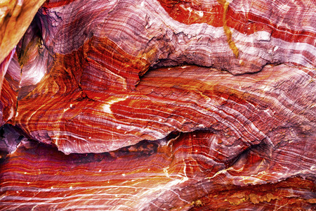 Red Rock Abstract Petra Jordan  Built by the Nabataens in 200 BC to 400 AD.  Rose Red canyon walls create many abstracts close up.  Inside the Tombs, the rose red can become blood red.  Reds are created by magnesium in sandstone.の写真素材