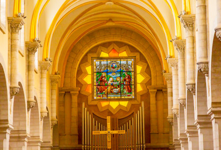 Saint Catherine Church Basilica Interior Stained Glass Cross Church of the Nativity Bethlehem West Bank Palestine. Saint Jerome lived here in Bethlehem 384 AD. Location of Jesus birth in writings in 160AD, church built in 326 AD by Constantineのeditorial素材