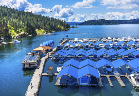 Blue Covers Boardwalk Marina Piers Boats Reflection Lake Coeur d' Alene Idahoの写真素材