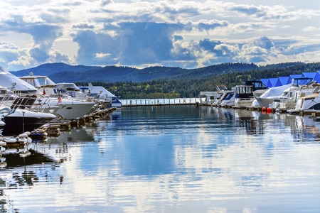 Blue Covers Boardwalk Marina Piers Boats Reflection Lake Coeur d' Alene Idahoの写真素材