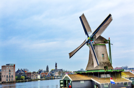 Wooden Lumber Windmill Zaanse Schans Old Windmill Village Countryside Holland Netherlands. Working windmills from the 16th to 18th century on the River Zaan.  Windmills powered industries in Holland, such as ship builidng, vegetable oil production.の写真素材